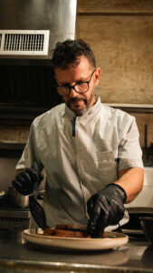 Chef plating a dish in the Fort Consolation kitchen
