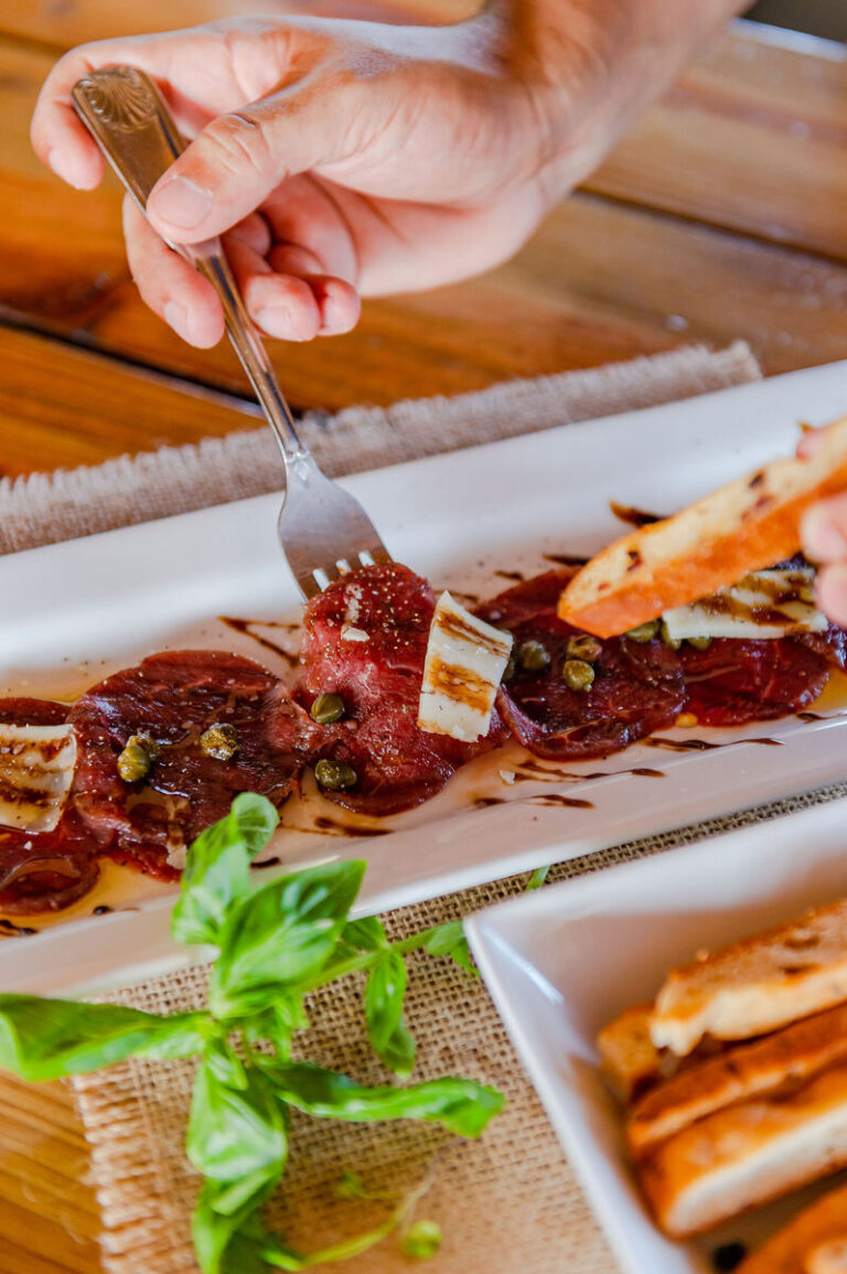 Beef carpaccio with parmesan, capers, balsamic reduction and crostini