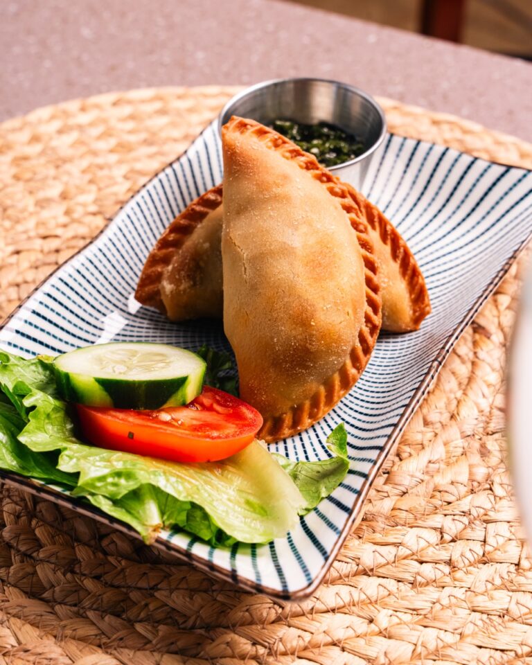 Beef empanadas with chimichurri and a side salad