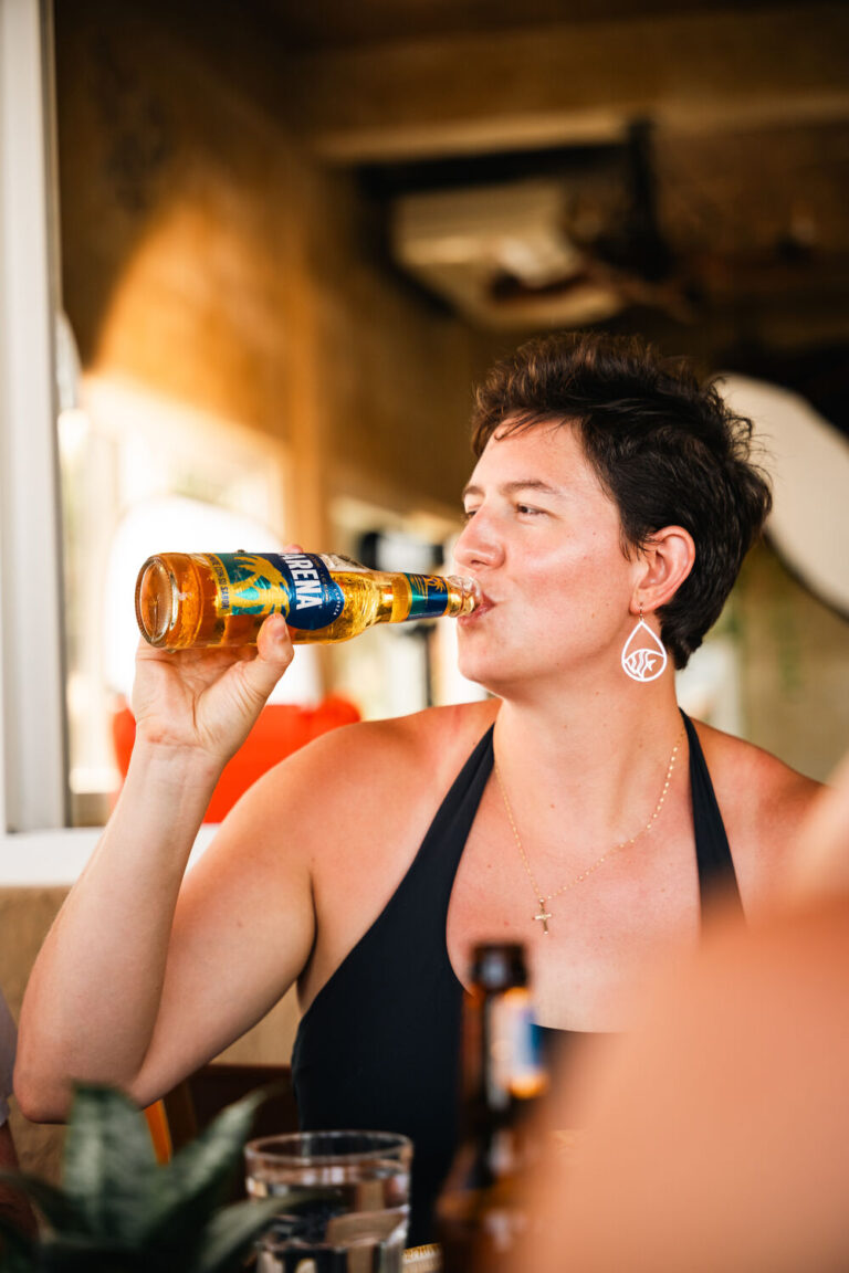 Guest enjoying a cold beer on the terrace at Fort Consolation