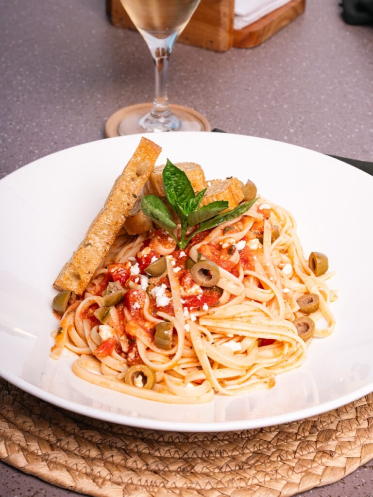 Linguini with tomato, green olives, feta and fresh basil